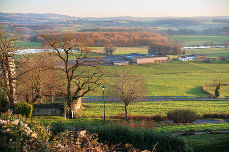 Cultivated field and farm in a Burgundy landscape in Franceの写真素材