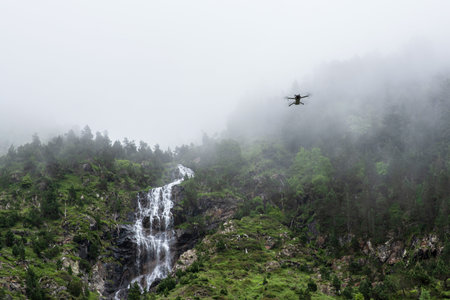 A drone flies over mountain landscapes in the Pyrenees, Franceの写真素材