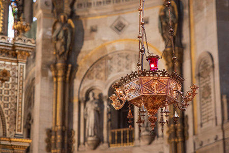 Red lamp in a Catholic church to symbolize Jesus' presence next to the tabernacleの写真素材