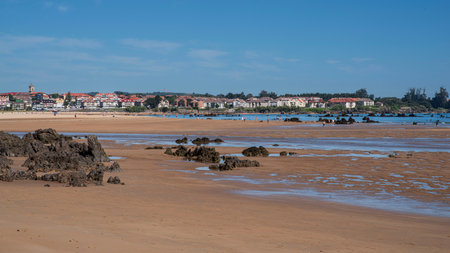 Trengandin beach with sand and black rocks in the town of Noja in Cantabria, Spainの写真素材