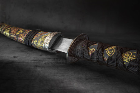 Close-up of an old black Japanese katana on a dark backgroundの写真素材