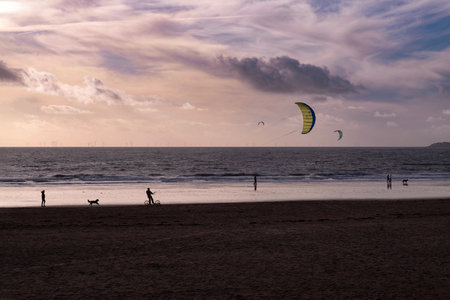 Kite surfing on a skateboard on the sand of a beach in Brittanyの写真素材