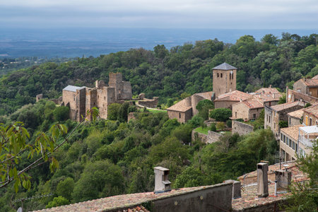 Medieval castle, church and village of Saissac in France, surrounded by nature