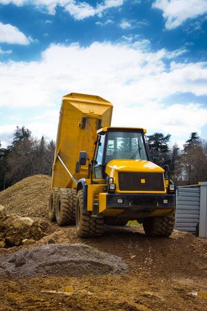frontview of a tipper truck on a sunny day