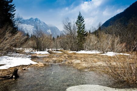 dramatic thaw over an alpine lake in late springの写真素材