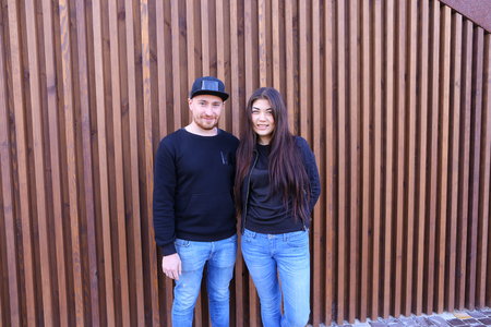 Beautiful man and woman cute chirping and awe and love relate to each other, discuss relationship and plan for future, communicate and hugging, looking at camera and posing for joint album with photographs, come rest and unwind in restaurant. Man dressed の写真素材