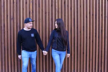 Beautiful man and woman cute chirping and awe and love relate to each other, discuss relationship and plan for future, communicate and hugging, looking at camera and posing for joint album with photographs, come rest and unwind in restaurant. Man dressed の写真素材