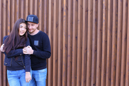 Beautiful man and woman cute chirping and awe and love relate to each other, discuss relationship and plan for future, communicate and hugging, looking at camera and posing for joint album with photographs, come rest and unwind in restaurant. Man dressed の写真素材