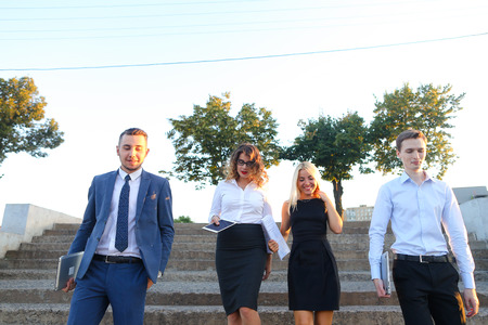 Young modern confident people, two boys and two girls, perspective entrepreneurs, students smiling,...