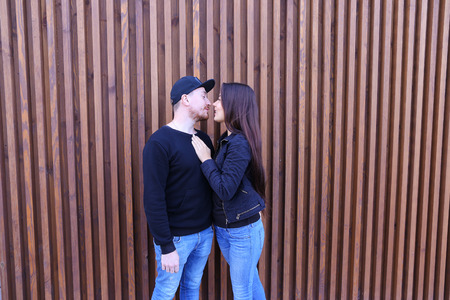 Beautiful man and woman cute chirping and awe and love relate to each other, discuss relationship and plan for future, communicate and hugging, looking at camera and posing for joint album with photographs, come rest and unwind in restaurant. Man dressed の写真素材
