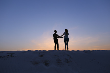 Girl runs to meet beloved boy, who runs towards her, lovers on move taking up arms and circling each...