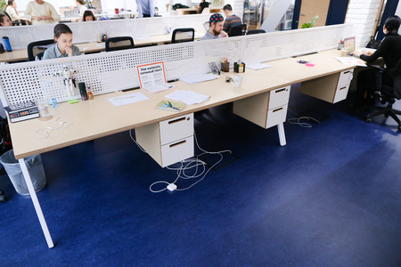 Concept of busy and working people in office or earning money, working area and computer room, education and prospects in work, arrangement and interior companies, gadgets and technology.のeditorial素材