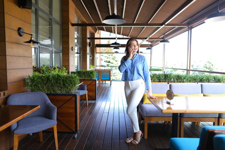 Beautiful female person speaking with boyfriend at cafe and discussing last dating .の写真素材