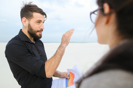 entrepreneurs create project of beach arrangement, colleagues come to location to discuss...