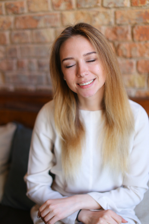 Young woman spending free time in coffee house