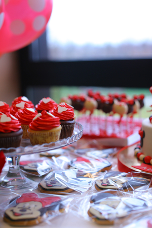Red cake for birthday. Concept of sweets for party.の写真素材