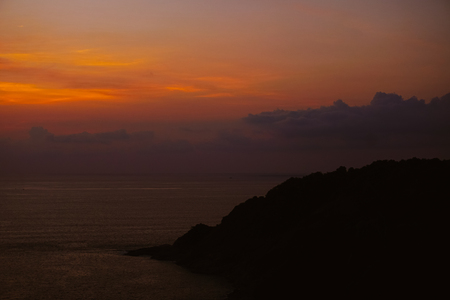 Amazing orange and violet sunset skyscape and sea. Concept of summer and sunrise background.の写真素材