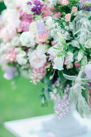 Blurry image with focus on bridalbouquet of flowers. Concept of floristic art and wedding decorations.の写真素材