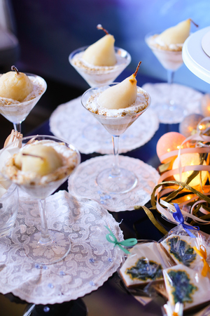 Sweet tasty pear in cream souffle for party. Concept of dessert and food.の写真素材