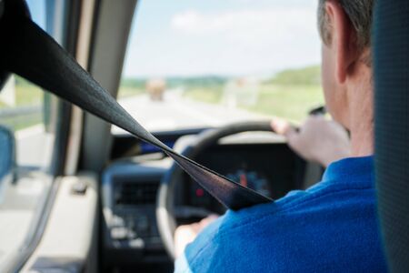 Focus on seat belt. Man hold wheel in hands and carries passenger to airport. Concept of quick taxi airport fly and driving school, road safety.のeditorial素材