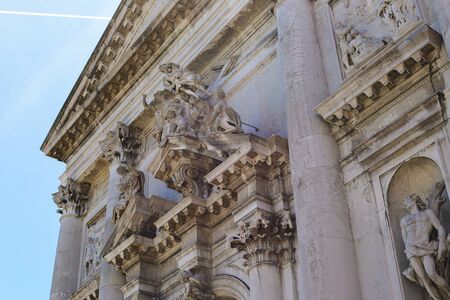 Closeup exterior with sculptures and columns in Venice, Italy. Concept of venetsian landmarks and architecture.の写真素材