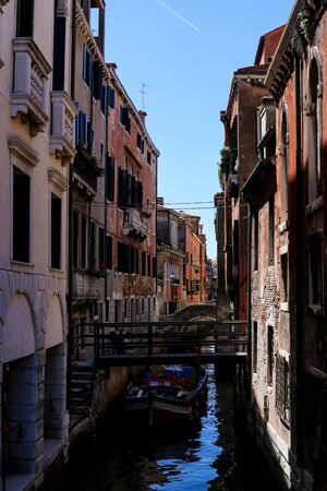 Venetsian street, water and cityscape, Italy. Concept of last minute tours to Venice, amazing sumer vacations and trip to Europe landmarks.の写真素材