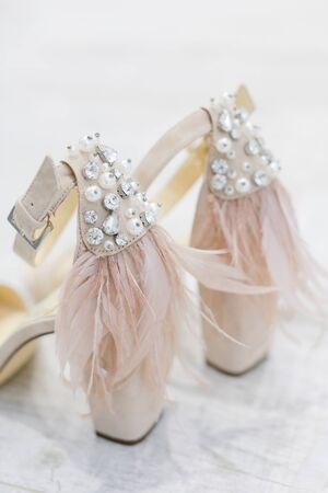 Closeup bridal shoes on white background. Concept of wedding elements.の写真素材