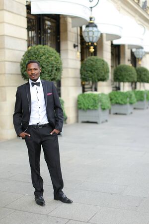 Afro american successful man wearing suit and standing outside. Concept of black businessman.の写真素材