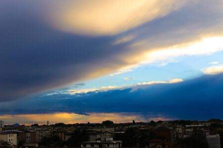 Wonderful cityscape in sunset backgound. Concept of dusk and summer cloudscape in city.の写真素材