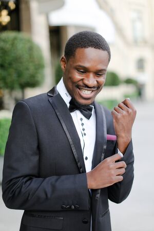 Afro american happy handsome man wearing suit and smiling. Concept of black businessman.の写真素材