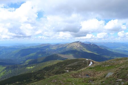 Amazing green Alps mountains and clouds in background. Concept of nature landscapes.の写真素材