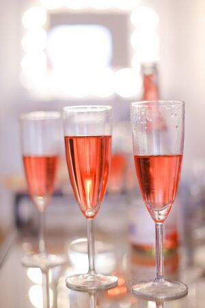 Chapagne wineglasses with rose wine. Concept of alcohol and party.の写真素材