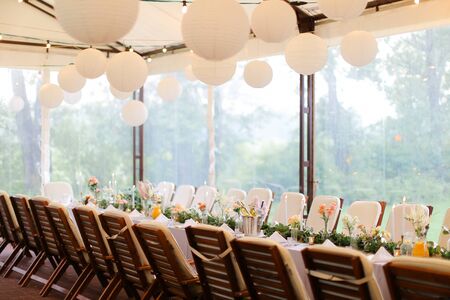 Long decorated and served table for banquet at restaurant. Concept of catering establishment.の写真素材