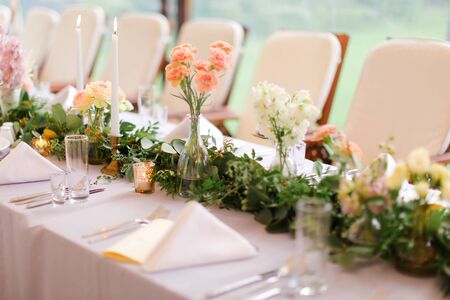 Decorated and nice served table for wedding. Concpt of bridal banquet.の写真素材