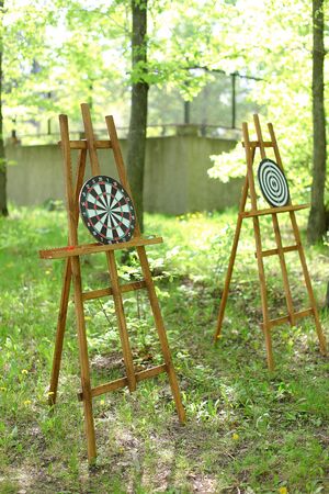 Darts targets on easels in garden. Concept of active games and rest.の写真素材
