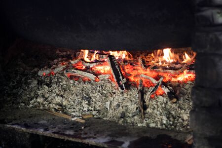 Ash and fire in fireplace Concept of warm.の写真素材
