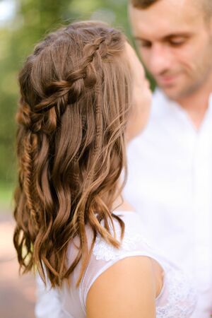 Happy groom with caucasian fiancee. Concept of married couple and love.の写真素材