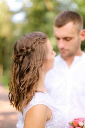 Happy handsome groom with caucasian bride. Concept of married couple and love.の写真素材