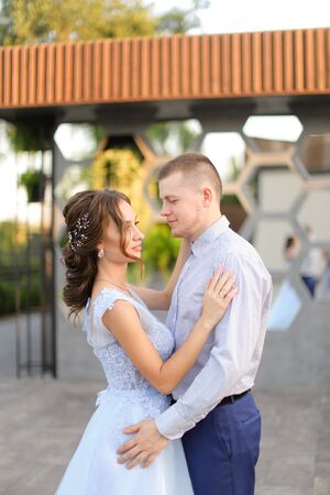 Caucasian american bride and groom dancing outside. Concept of wedding photo session outdoor.の写真素材
