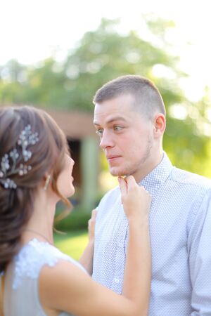 Close up caucasian fiancee dancing with groom in park. Concept of wedding and love.の写真素材
