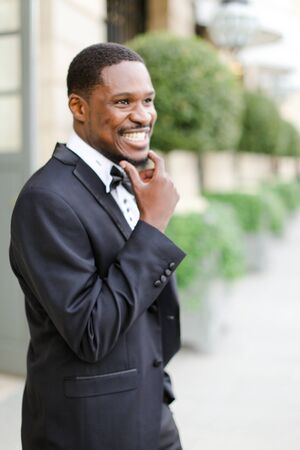 Afro american happy good looking male person wearing suit and smiling. Concept of black businessman.の写真素材