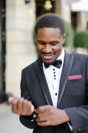 Afro american happy man wearing suit and smiling. Concept of black businessman.の写真素材