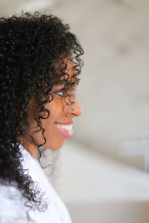 Portrait of afro american curly haired young woman. Concept of african female beauty.の写真素材