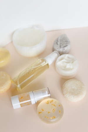 Spray bottles with lotions, hydrolats and eco soaps for healthcare. Concept of organic cosmetics, homemade non gmo products for body and online shop.の写真素材