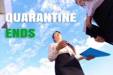 Caucasian businesswoman standing in sky background with papers. Concept of quarantine ends.