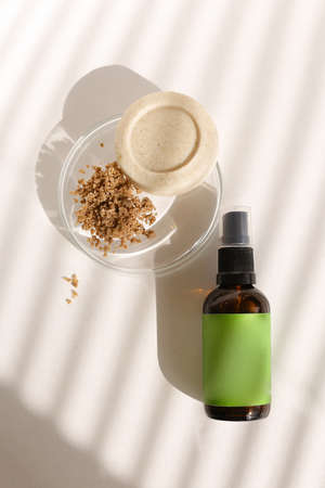 Close up spray bottle with green space for your brand and solid soap near clay powder. Concept of organic cluelty free, kosher cosmetic online shop and pampering.の写真素材