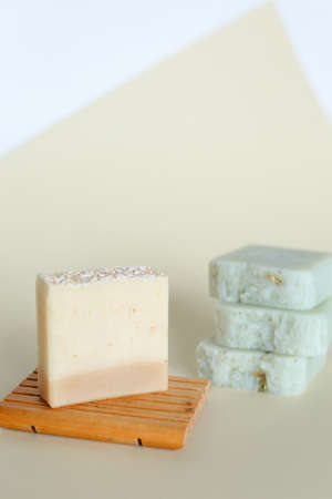 Handmade bars of soap with essential blend of lavender on wooden stand. Concept of organic cosmetics online shop, non gmo skincare.の写真素材