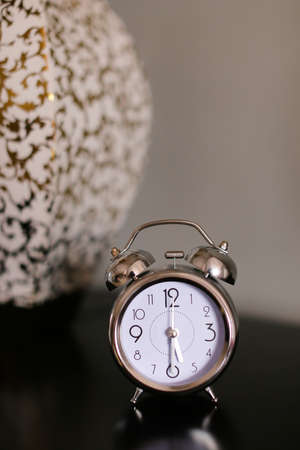 Antique clock in black background.の写真素材