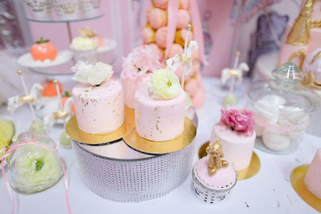 Many yummy sweets, cakes and candies on wedding table.の写真素材