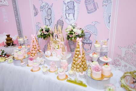 Many sweets, cakes and candies on wedding table.の写真素材